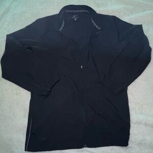 Men’s Nike dry fit long sleeve windbreaker type material but smoother size XL